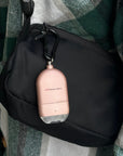 MaxxmAlarm Illume 130dB Personal Alarm attached to a handbag, featuring a portable emergency alarm and safety light for personal protection.