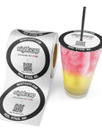 NightCap and StopTopps drink protection sticker roll beside a cocktail sealed with a peel-and-stick drink safety cover and reusable straw.